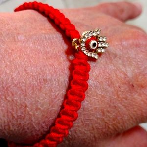 Pull string ankle bracelet.